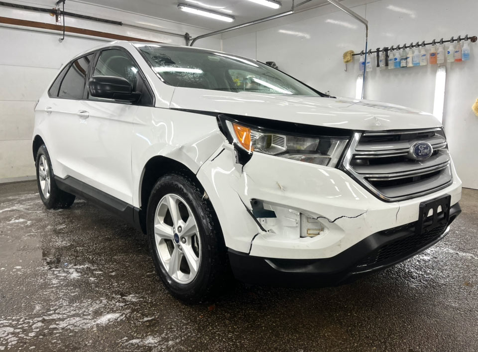 White Ford Before Body Repairs at Baker's Body Shop